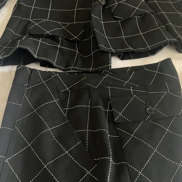 Trina Turk black pant suit. Great boot cut trouser and fitted jacket. - Picture 2 of 5